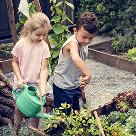 Two children gardening