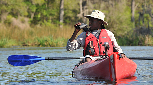 kayaker with binoculars