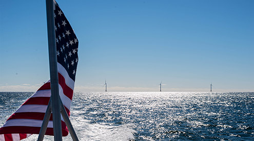 American flag and offshore wind turbines, NWF Staff